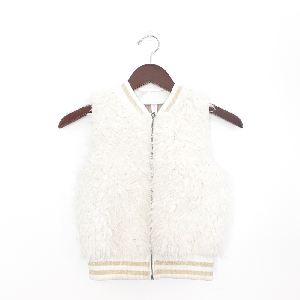 White fur vest
